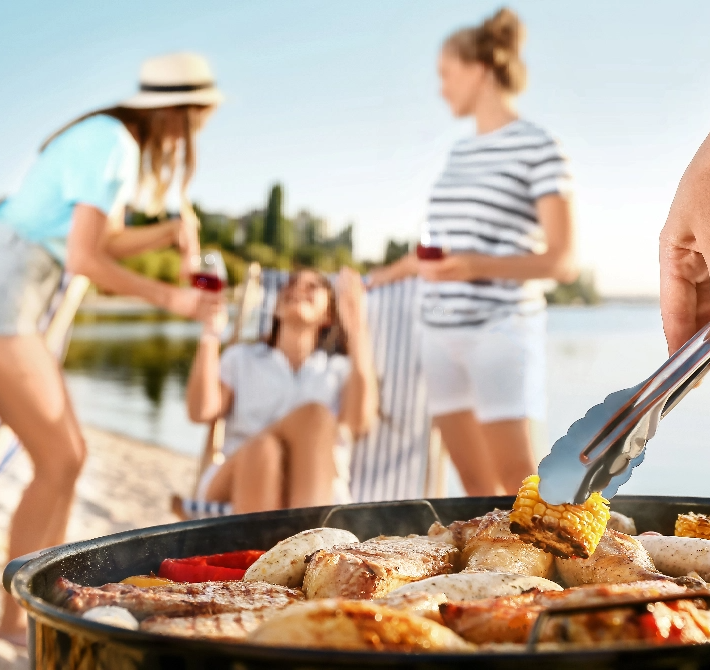 stock-photo-man-cooking-tasty-food-on-barbecue-grill-outdoors-closeup-1527934907@2x